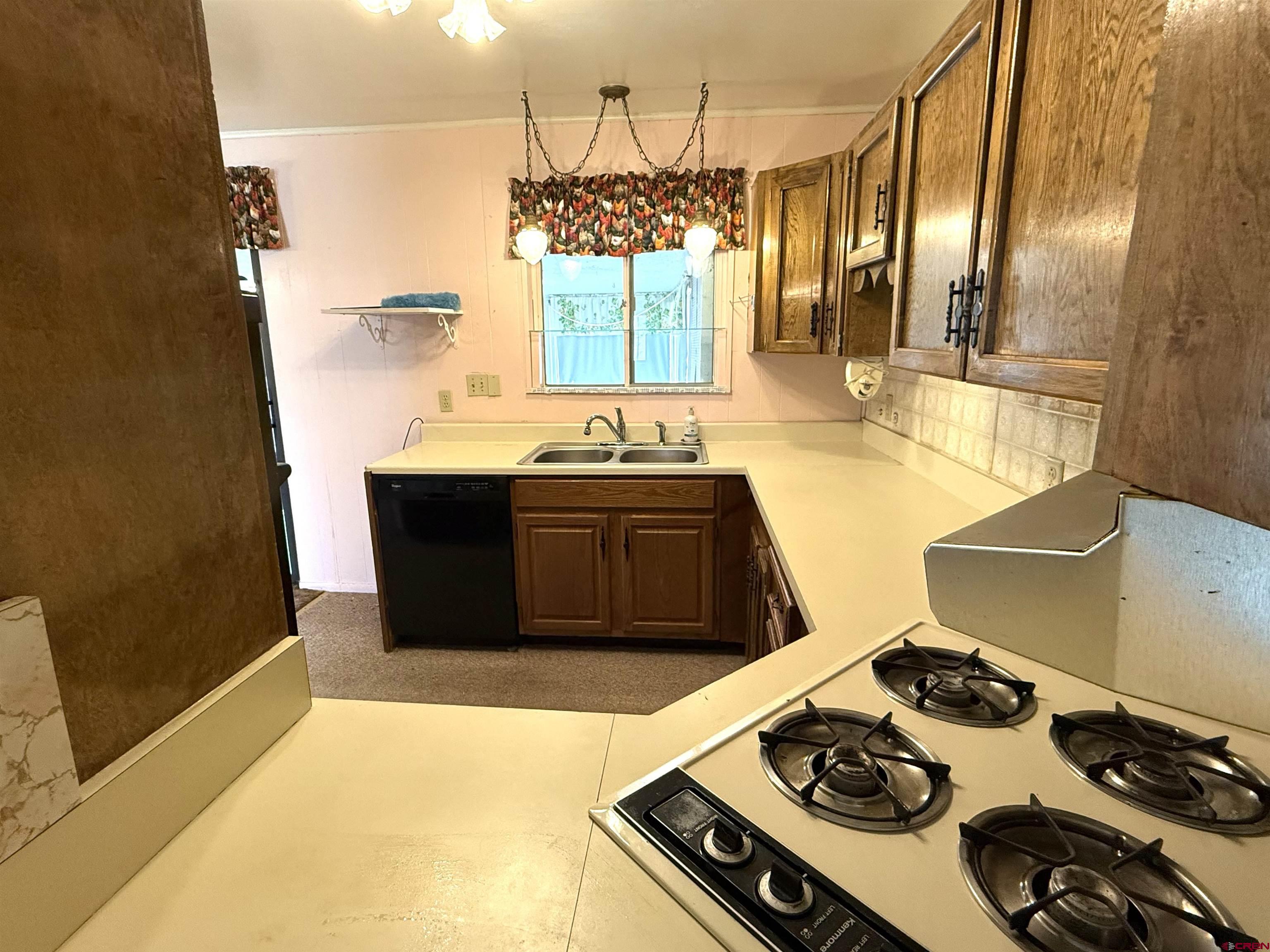 609 East 2nd Street Cortez, CO 81321 - Photo 8 of 21 a kitchen with a stove and a sink