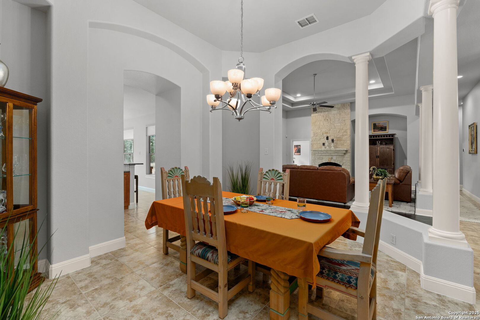 2956 Rio Cordillera Boerne, TX 78006 - Photo 12 of 41 a view of a dining room with furniture and chandelier