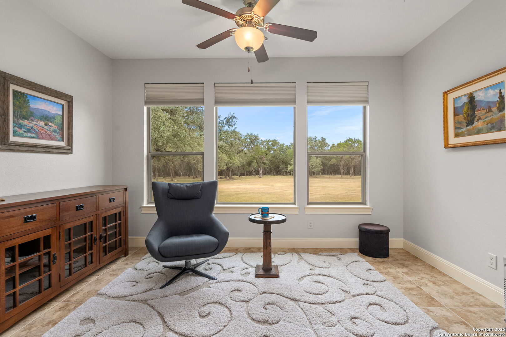2956 Rio Cordillera Boerne, TX 78006 - Photo 22 of 41 a living room with furniture a flat screen tv and a window
