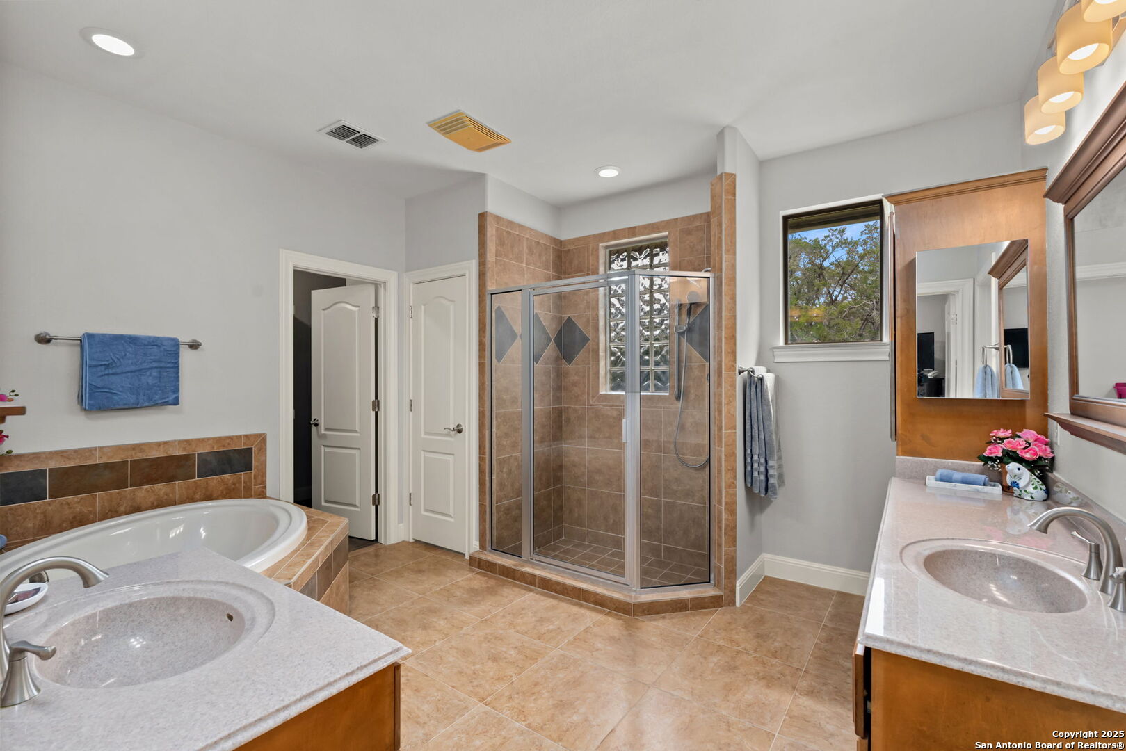 2956 Rio Cordillera Boerne, TX 78006 - Photo 24 of 41 a bathroom with a sink double vanity and a shower