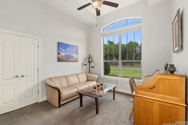 a living room with furniture and a window