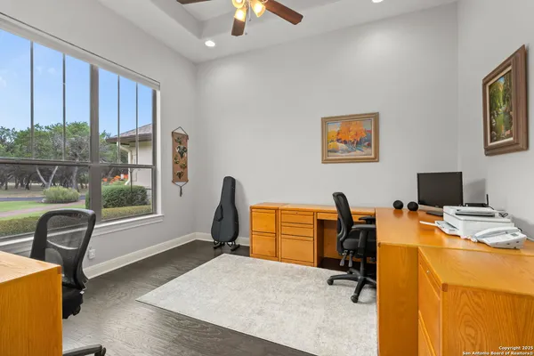 a workspace with furniture and a window