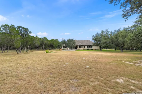 a view of outdoor space with trees all around