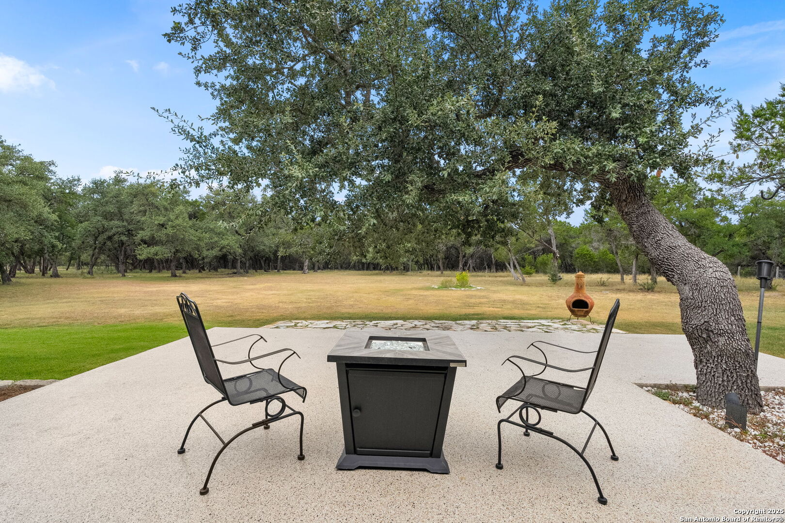 2956 Rio Cordillera Boerne, TX 78006 - Photo 33 of 41 a view of a chairs and table on the patio and a lake view