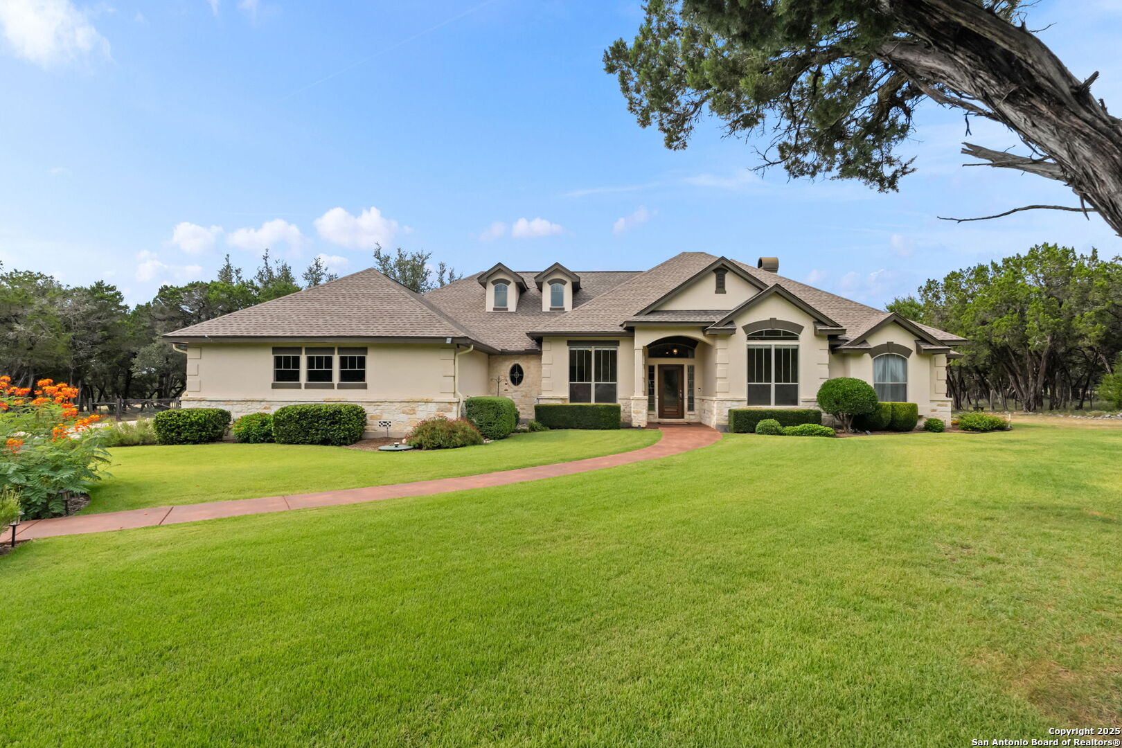2956 Rio Cordillera Boerne, TX 78006 - Photo 38 of 41 a view of a white house with a yard and sitting area