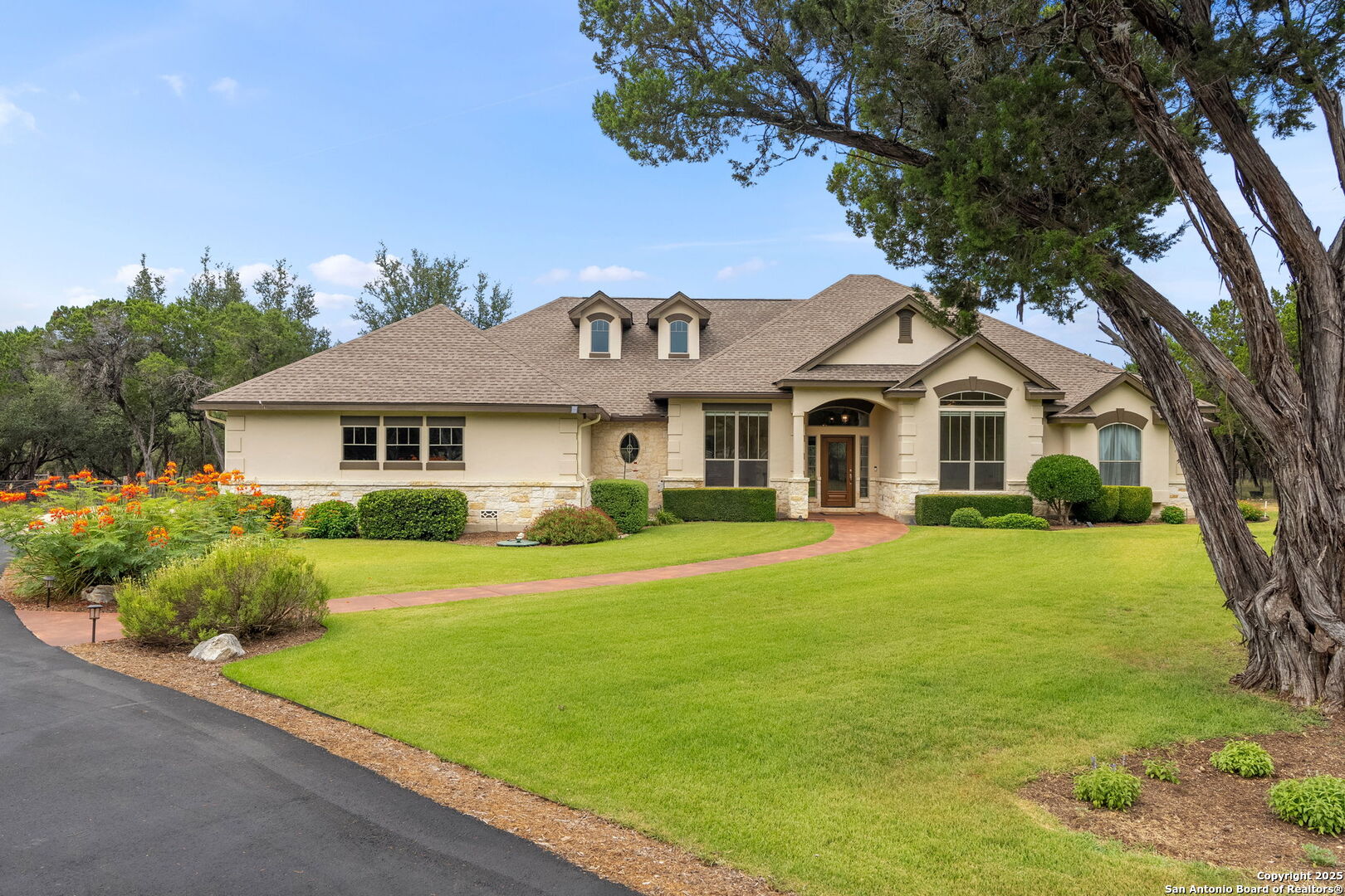 2956 Rio Cordillera Boerne, TX 78006 - Photo 39 of 41 a front view of a house with a yard
