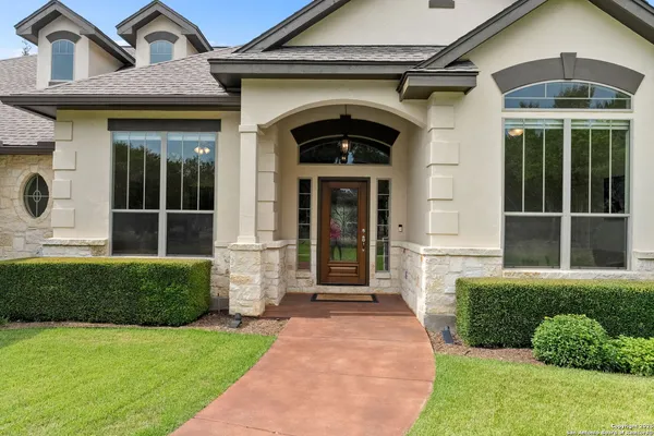 a front view of a house with a yard