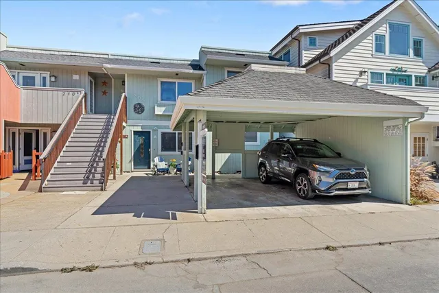 a view of a car parked in front of a house