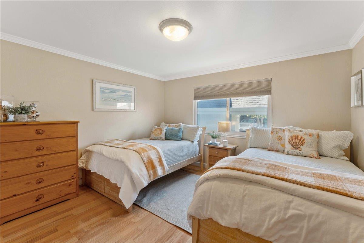 208 Stockton Avenue Capitola, CA 95010 - Photo 15 of 36 a bedroom with two beds and a window