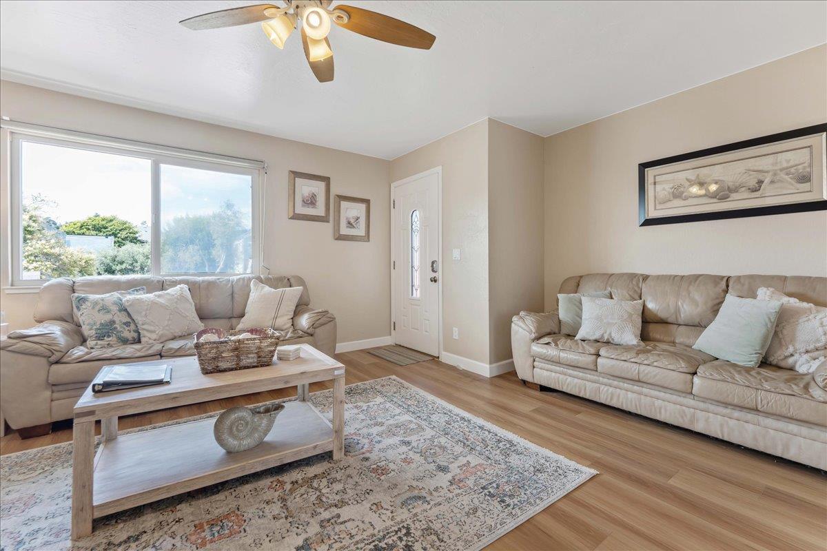 208 Stockton Avenue Capitola, CA 95010 - Photo 22 of 36 a living room with furniture and a rug