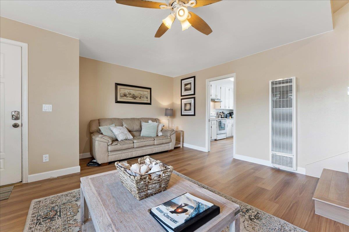 208 Stockton Avenue Capitola, CA 95010 - Photo 23 of 36 a living room with furniture and wooden floor