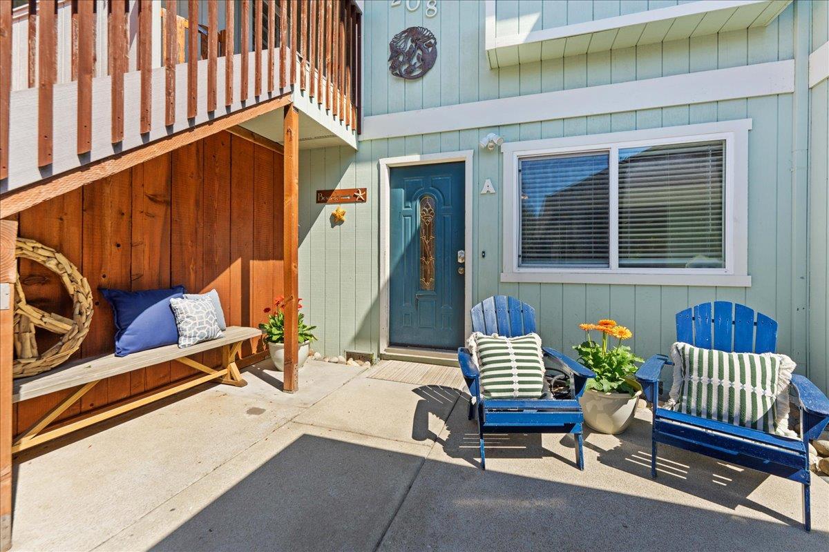 208 Stockton Avenue Capitola, CA 95010 - Photo 3 of 36 a view of front door with chair and outdoor seating