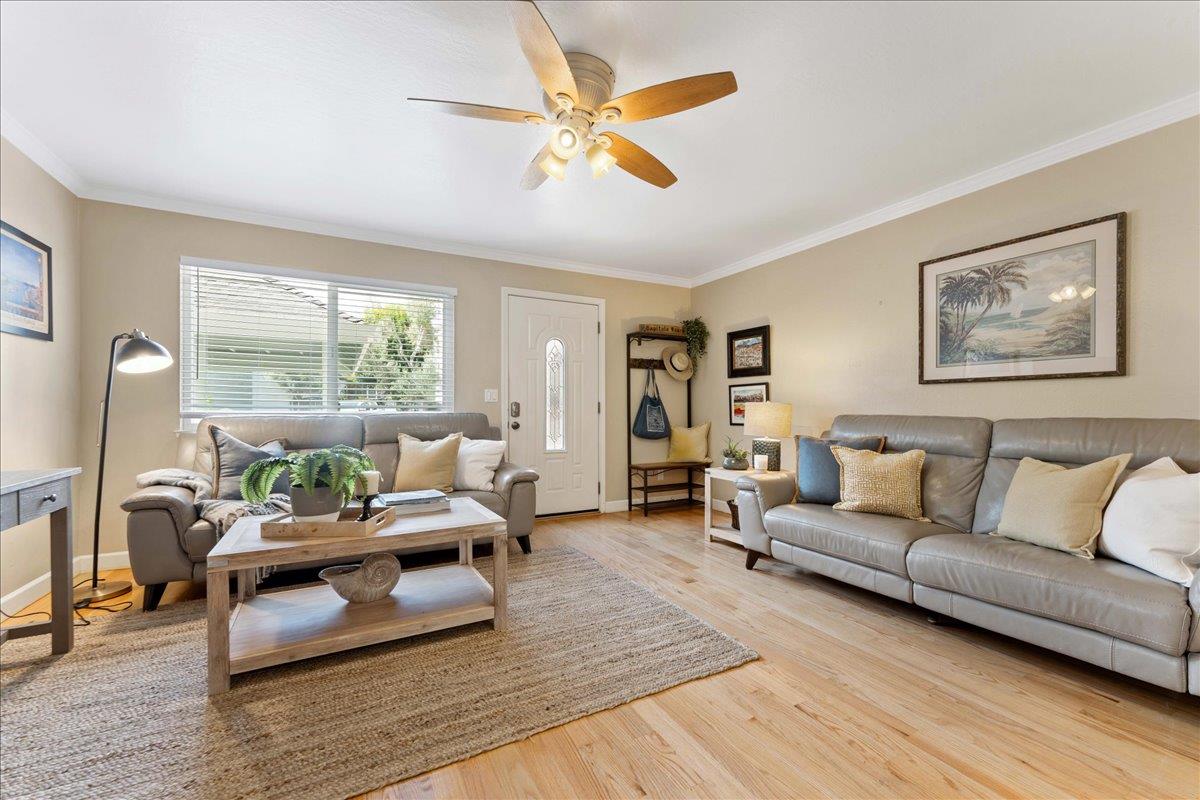 208 Stockton Avenue Capitola, CA 95010 - Photo 9 of 36 a living room with furniture and a wooden floor