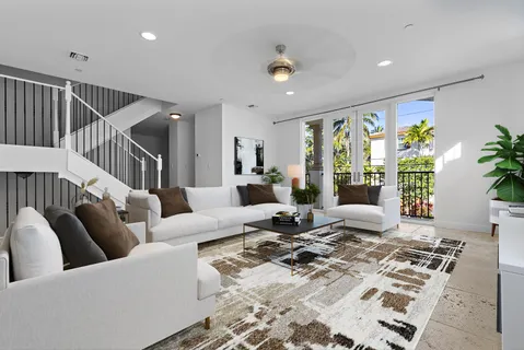 a living room with furniture rug and white walls