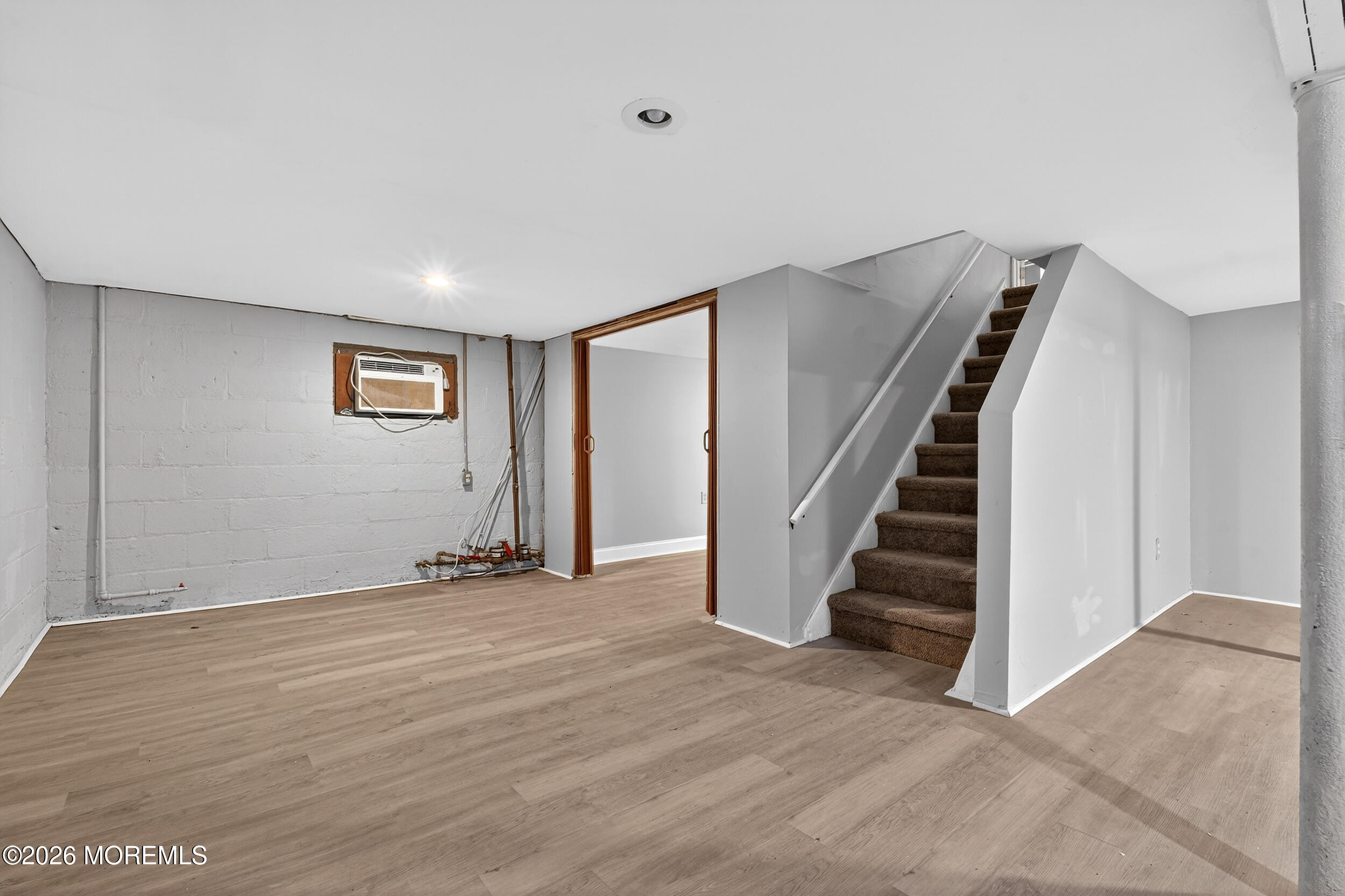 49 Middlesex Road, Unit A Matawan, NJ 07747 - Photo 24 of 40 a view of an empty room with wooden floor