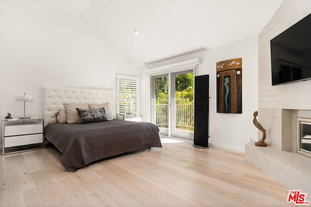 24762 Vía Pradera Calabasas, CA 91302 - Photo 15 of 29 a living room with a bed furniture and a flat screen tv