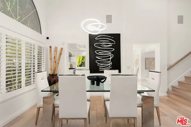 a kitchen with appliances cabinets and furniture