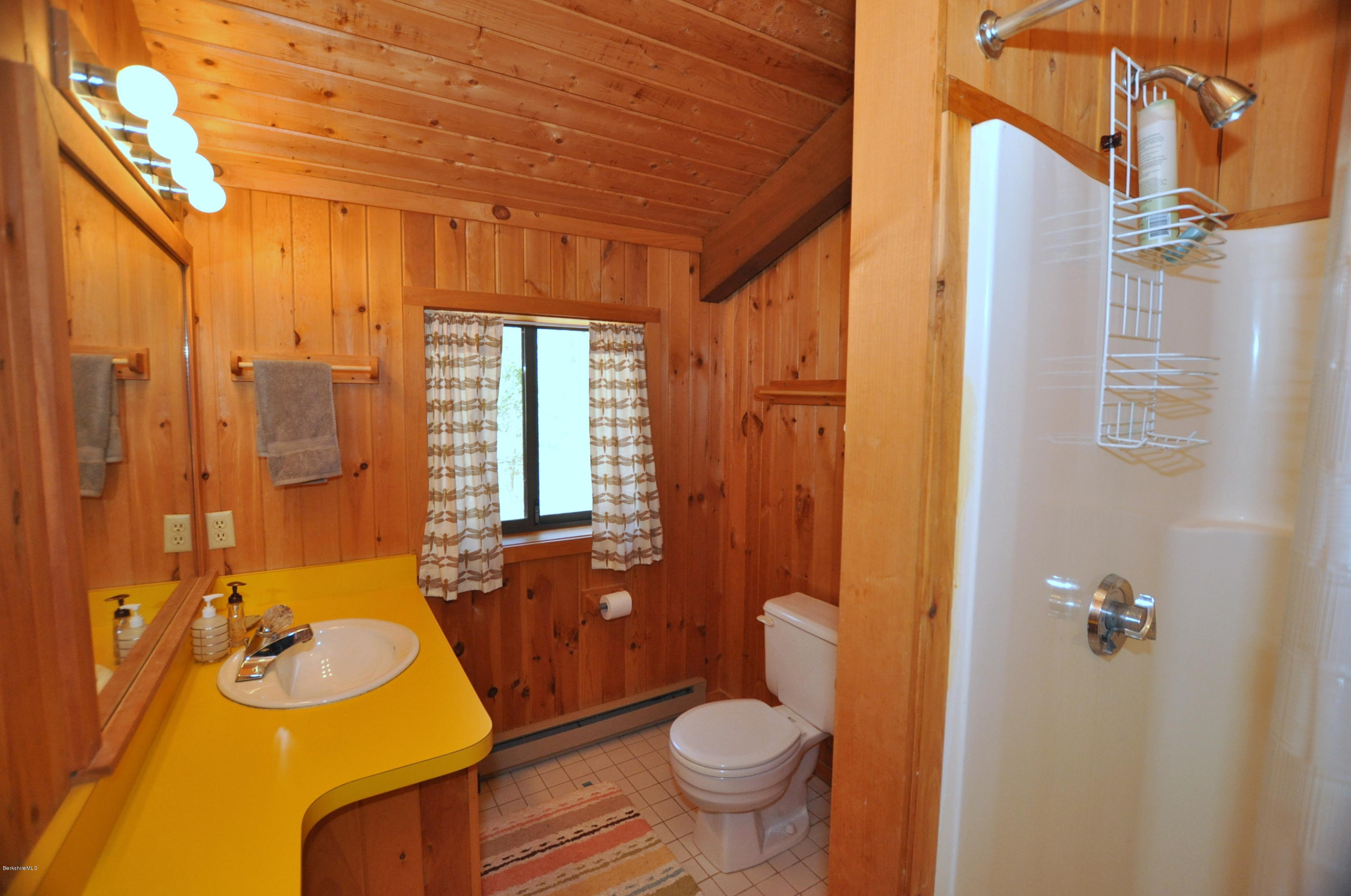 450 Bonny Rigg Hill Road Becket, MA 01223 - Photo 22 of 26 a bathroom with a sink toilet and shower