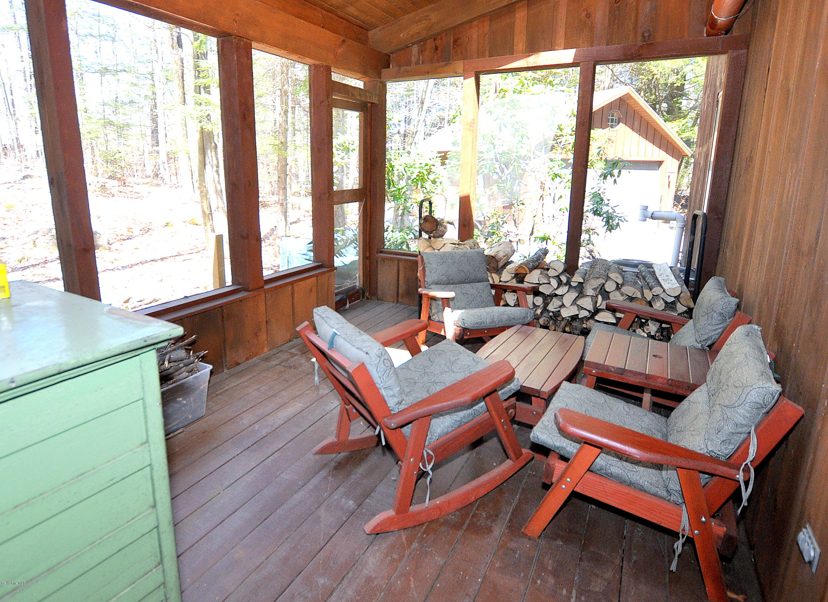 450 Bonny Rigg Hill Road Becket, MA 01223 - Photo 8 of 26 a room with wooden furniture and a window