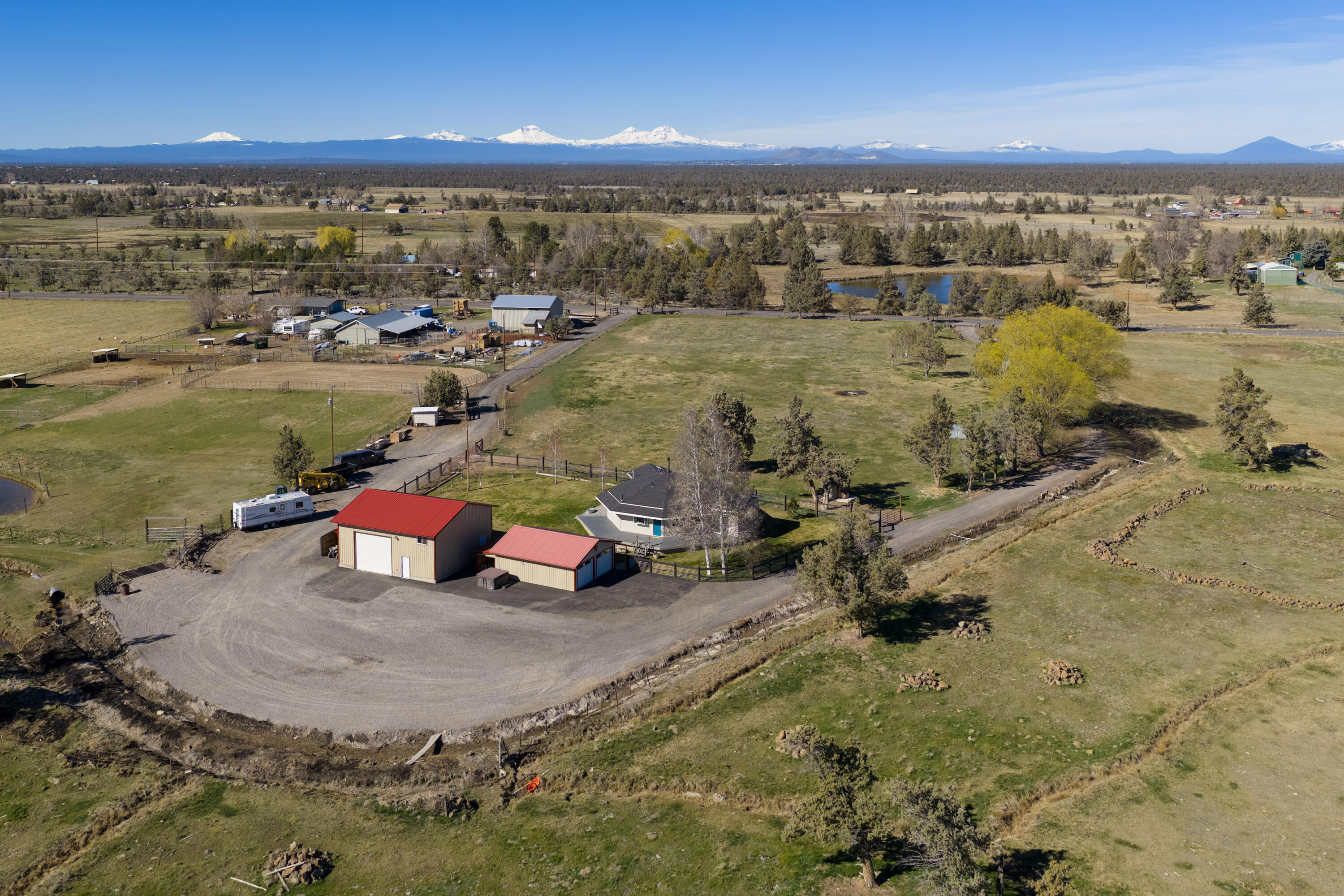 4074 Southwest Reif Road Powell Butte, OR 97753 - Photo 50 of 59 an aerial view of a house with a lake view