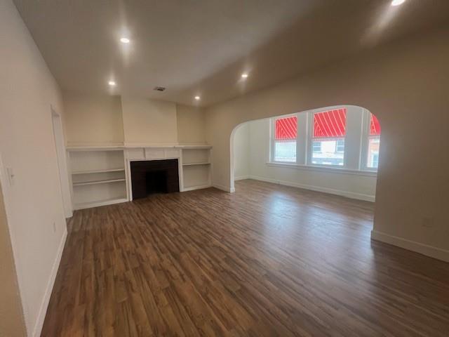 566 Merchant Street Ambridge, PA 15003 - Photo 15 of 20 an empty room with wooden floor and windows