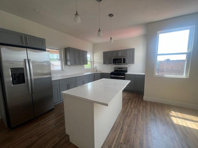 566 Merchant Street Ambridge, PA 15003 - Photo 16 of 20 a kitchen with kitchen island a counter top space a sink and stainless steel appliances