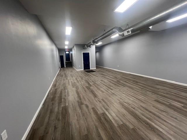 566 Merchant Street Ambridge, PA 15003 - Photo 3 of 20 an empty room with wooden floor and windows