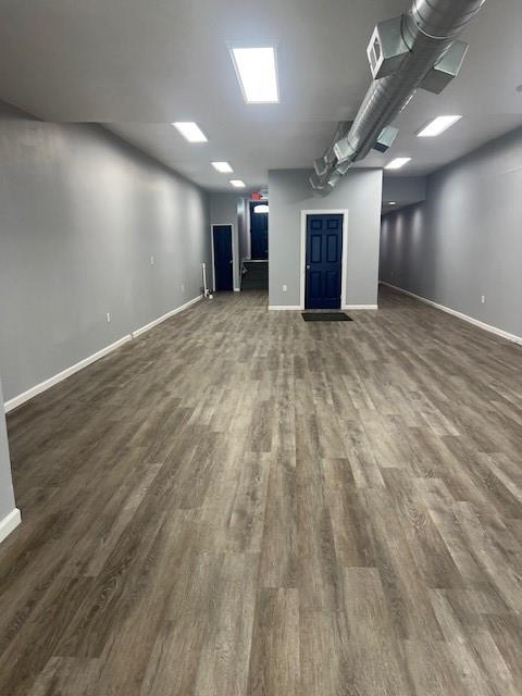 566 Merchant Street Ambridge, PA 15003 - Photo 4 of 20 an empty room with wooden floor and windows