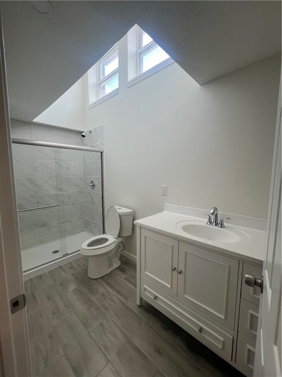566 Merchant Street Ambridge, PA 15003 - Photo 8 of 20 a bathroom with a sink a toilet and shower