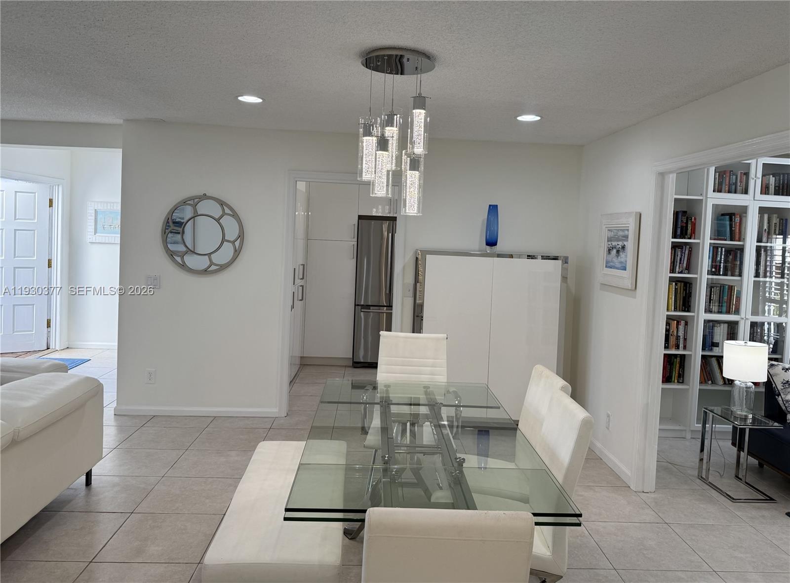 4161 South Us Highway, Unit K1 Jupiter, FL 33477 - Photo 11 of 49 a living room with furniture a rug and white walls