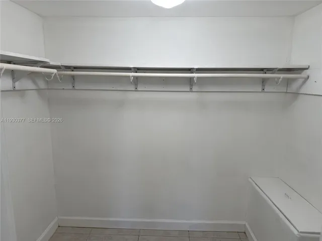 a bedroom with a bed and a furniture