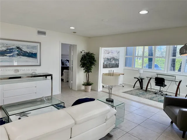 a living room with furniture or couch and a coffee table