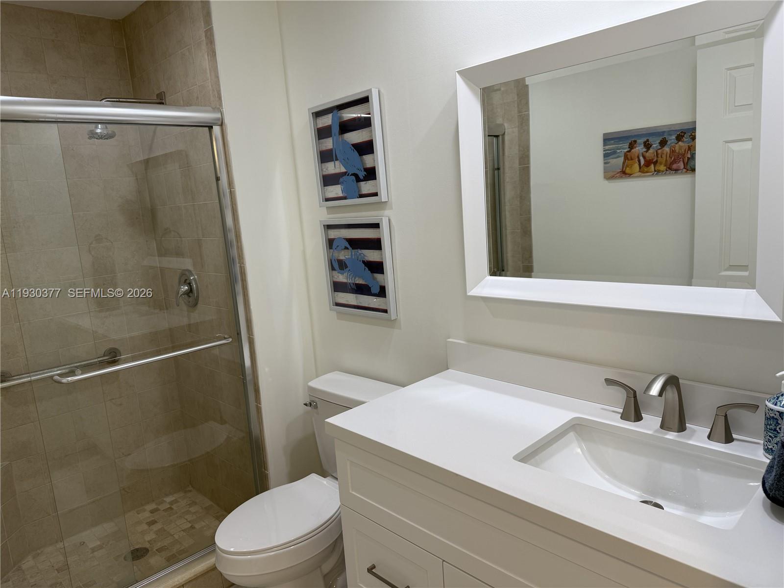 4161 South Us Highway, Unit K1 Jupiter, FL 33477 - Photo 24 of 49 a bathroom with a sink a toilet and shower
