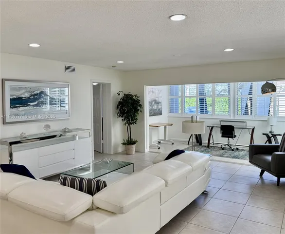 a view of a living room and dining room