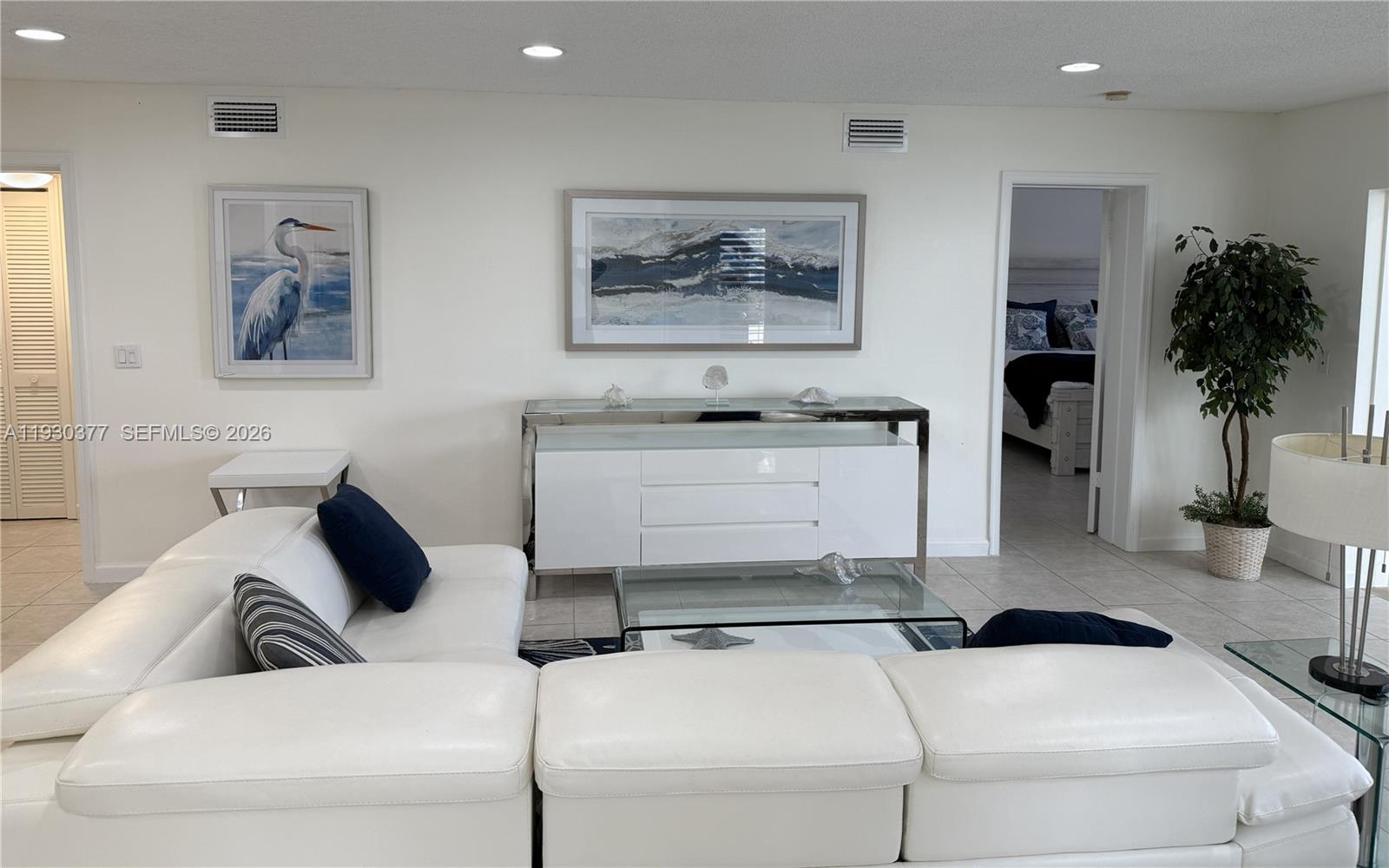 4161 South Us Highway, Unit K1 Jupiter, FL 33477 - Photo 34 of 49 a living room with furniture and a potted plant