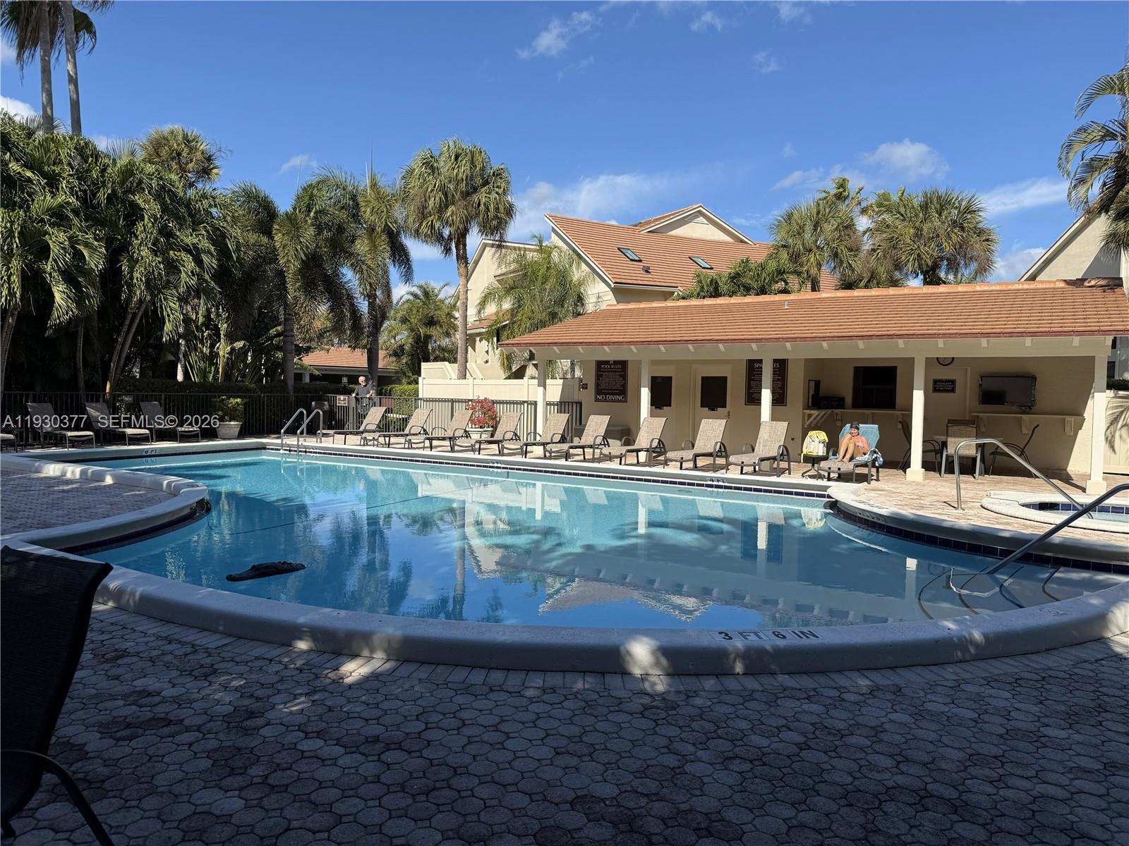 4161 South Us Highway, Unit K1 Jupiter, FL 33477 - Photo 37 of 49 a view of a house with pool and chairs