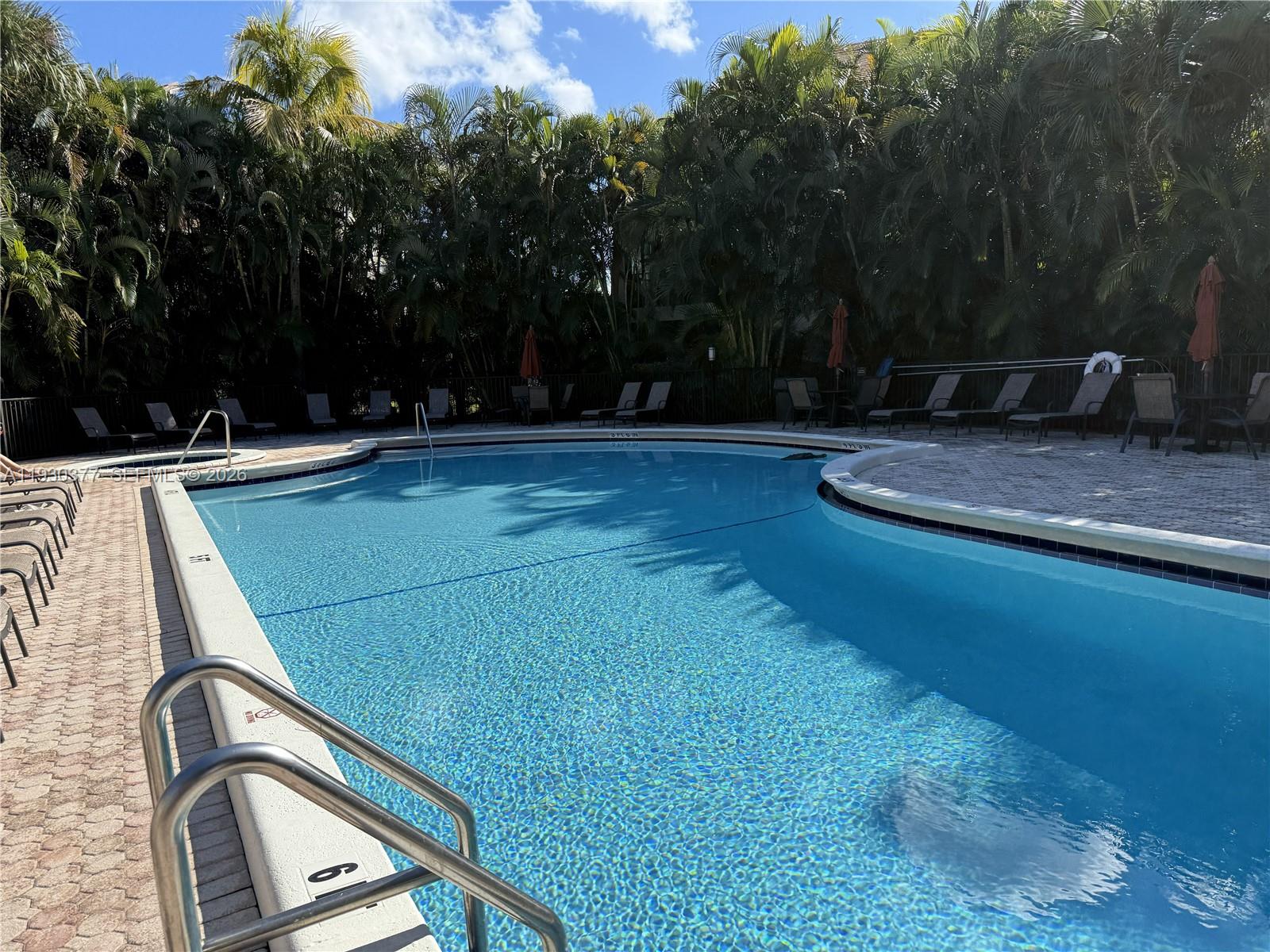 4161 South Us Highway, Unit K1 Jupiter, FL 33477 - Photo 39 of 49 a view of a backyard with swimming pool