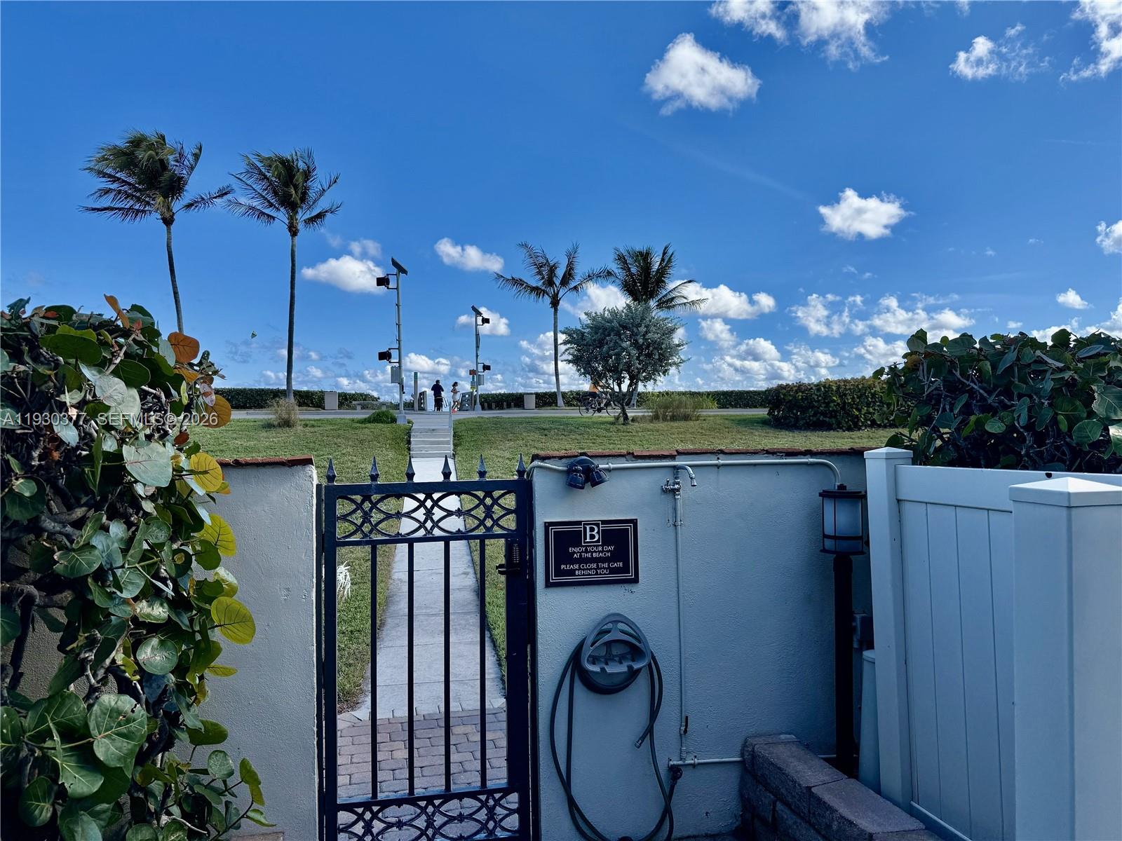 4161 South Us Highway, Unit K1 Jupiter, FL 33477 - Photo 42 of 49 a view of a patio with table and chairs potted plants