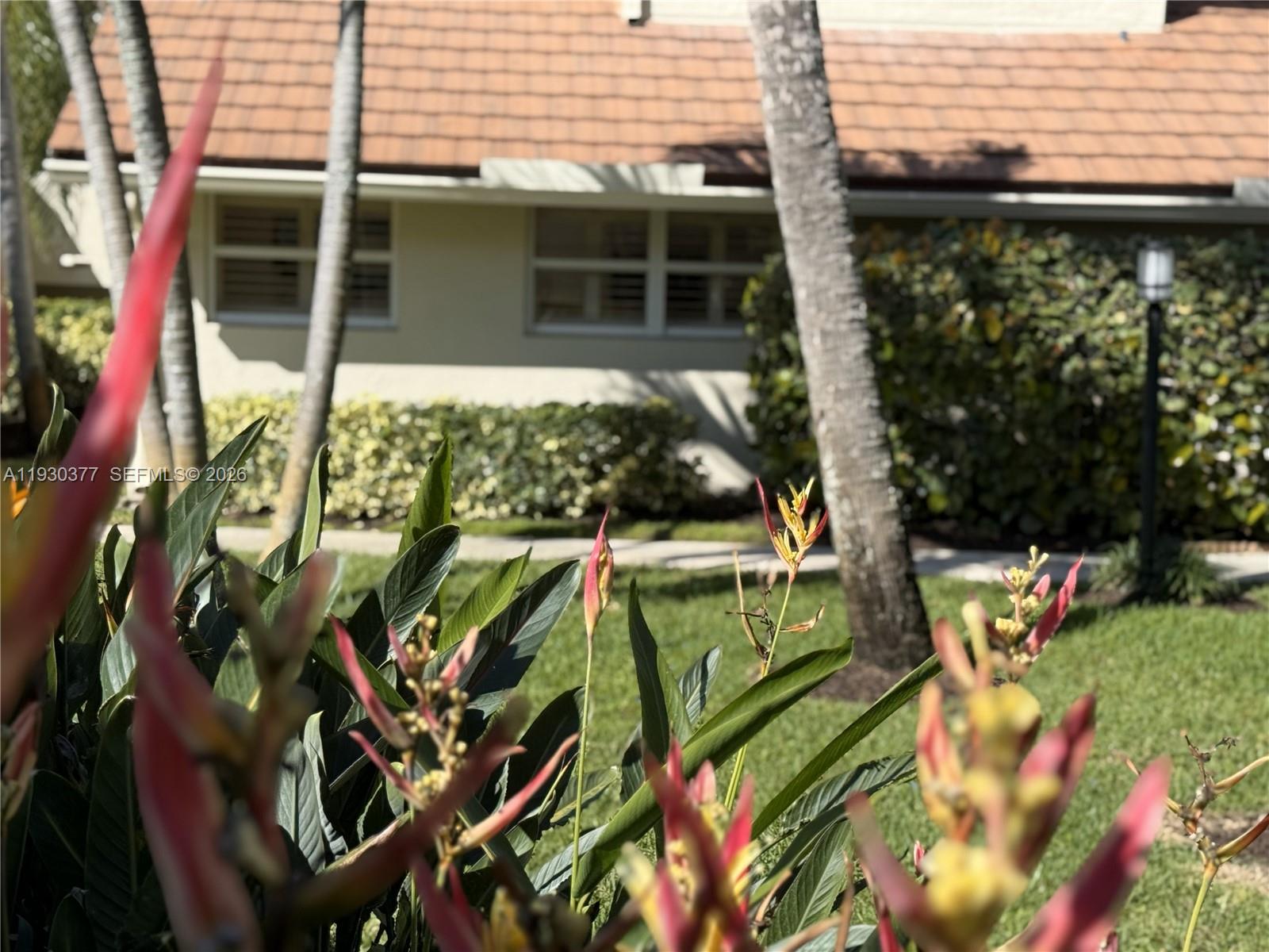 4161 South Us Highway, Unit K1 Jupiter, FL 33477 - Photo 48 of 49 a view of a house with a yard