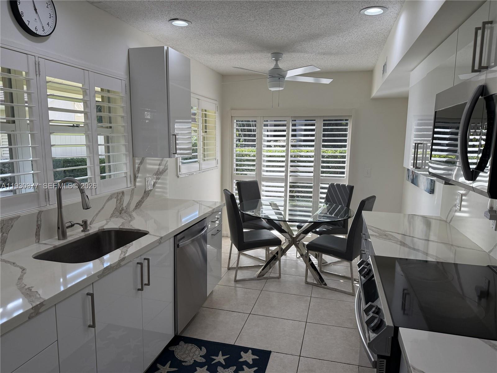 4161 South Us Highway, Unit K1 Jupiter, FL 33477 - Photo 7 of 49 a kitchen with a sink cabinets and window