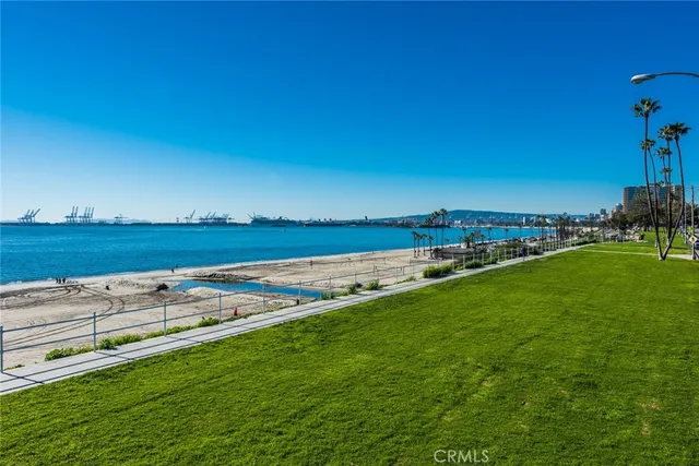 a view of a lake with houses in the back
