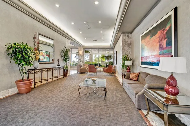 a living room with furniture and a potted plant