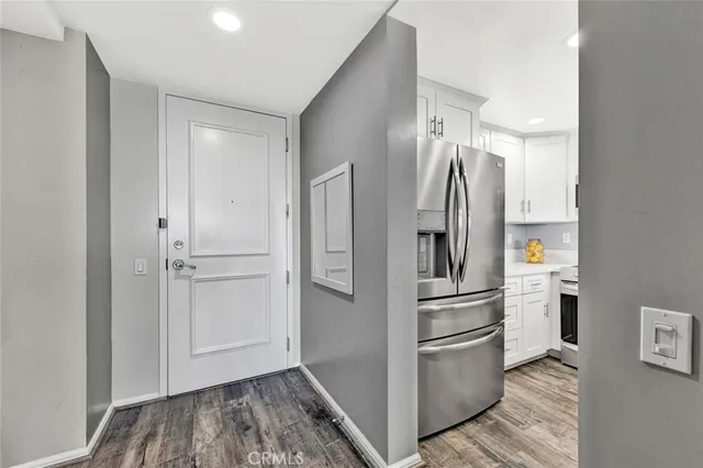 a kitchen with stainless steel appliances a refrigerator and a sink