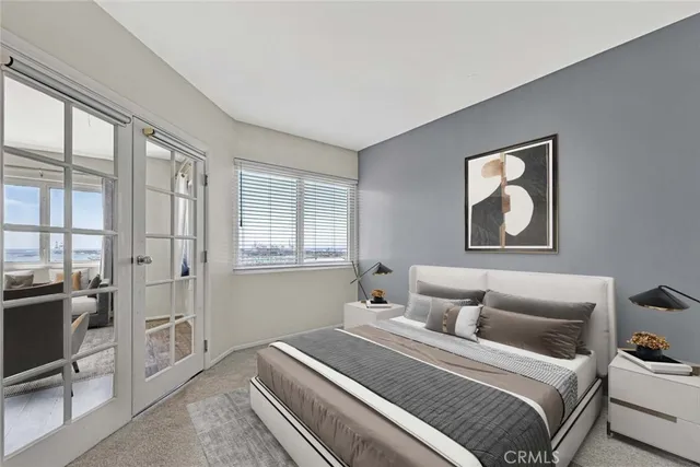 a bedroom with double bed and a window