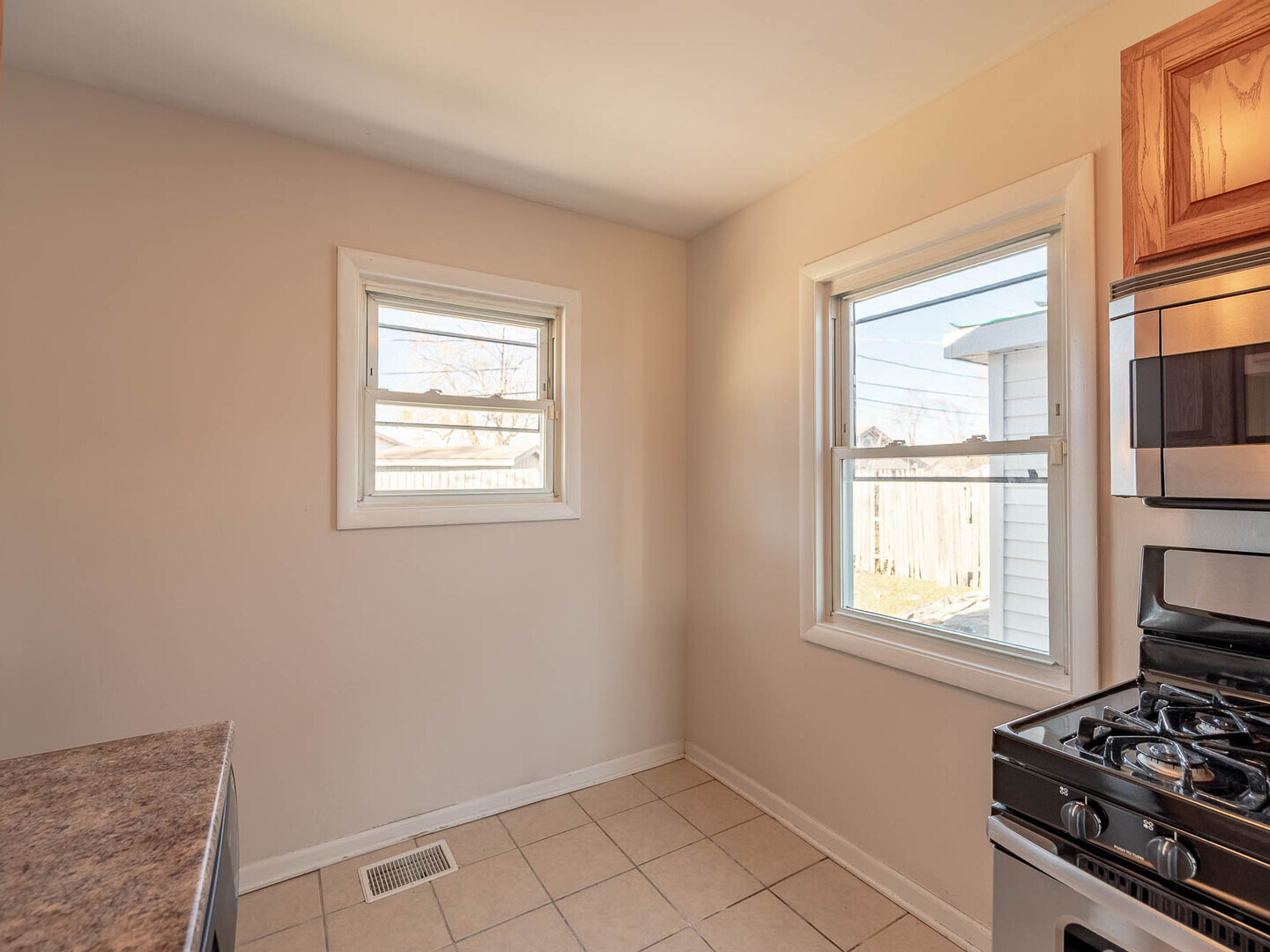 1621 Inner Cir Drive Crest Hill, IL 60403 - Photo 6 of 12 a view of a kitchen with wooden floor and electronic appliances