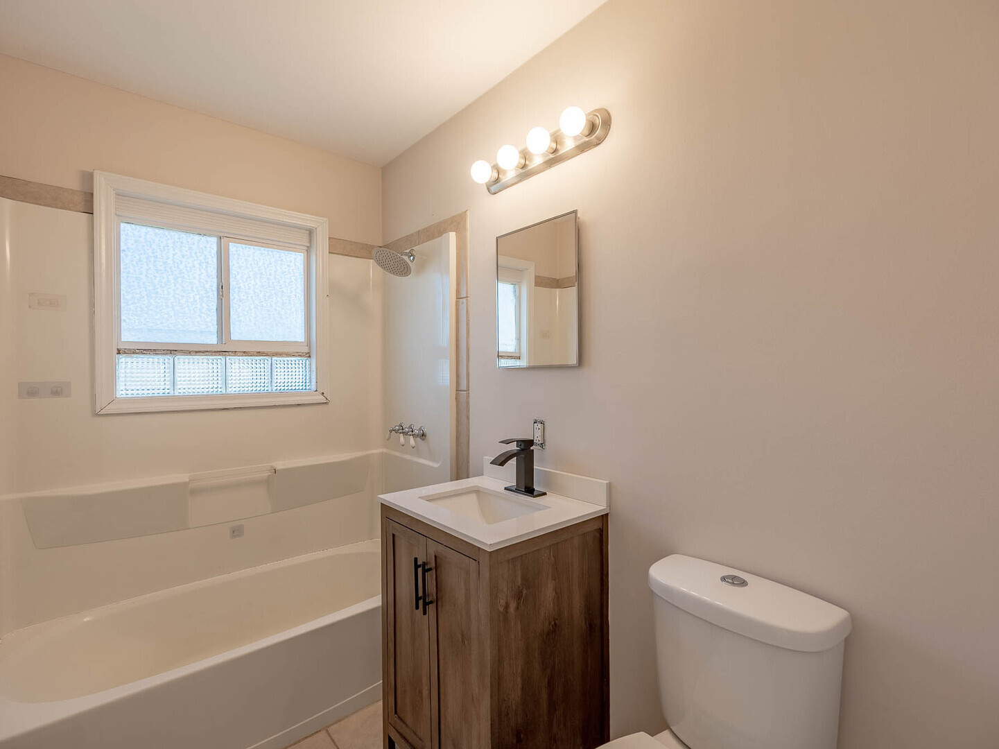 1621 Inner Cir Drive Crest Hill, IL 60403 - Photo 10 of 12 a bathroom with a sink a toilet and a bathtub