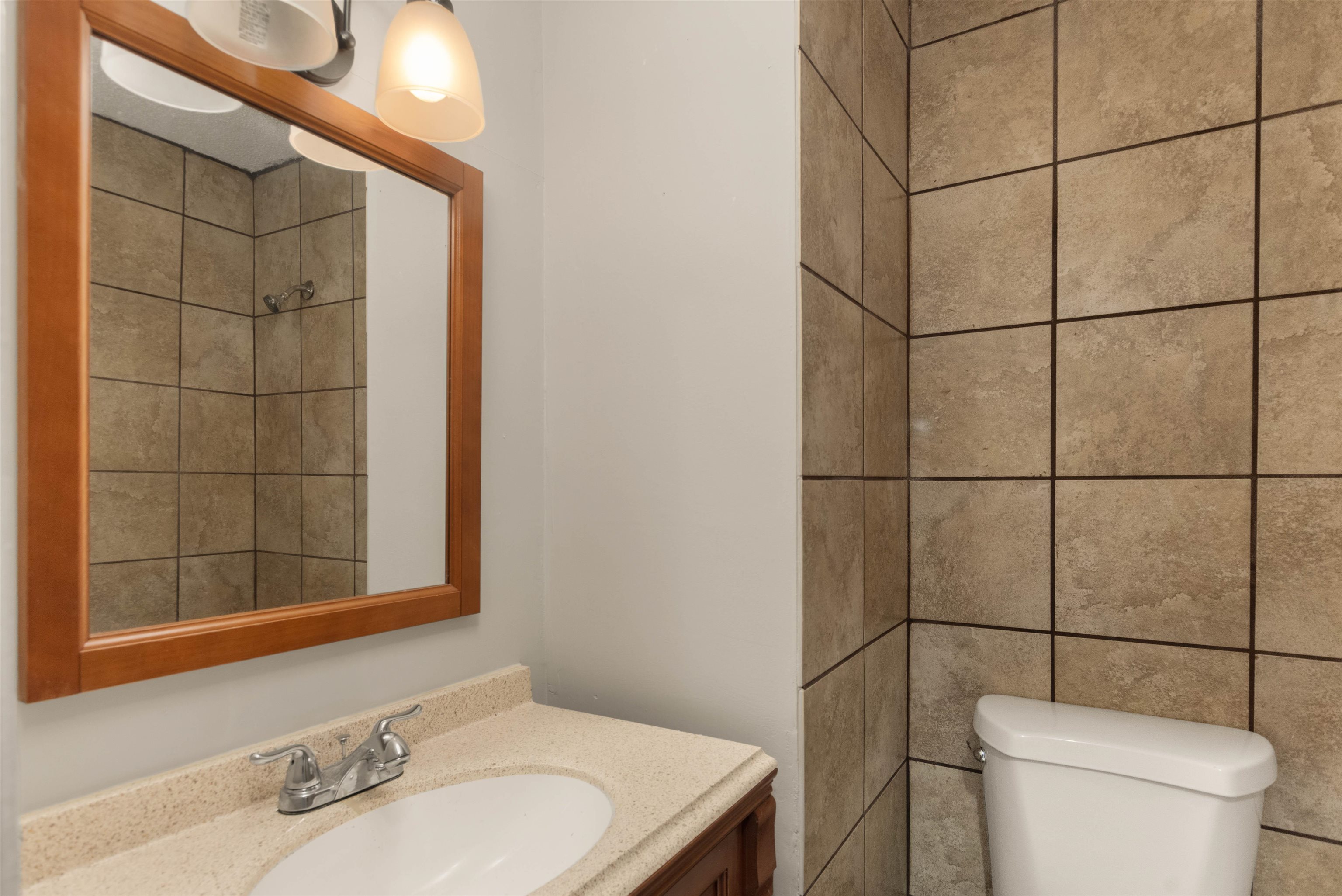 5573 Pleasant View Road, Unit 35 Memphis, TN 38134 - Photo 20 of 25 a bathroom with a sink toilet and shower