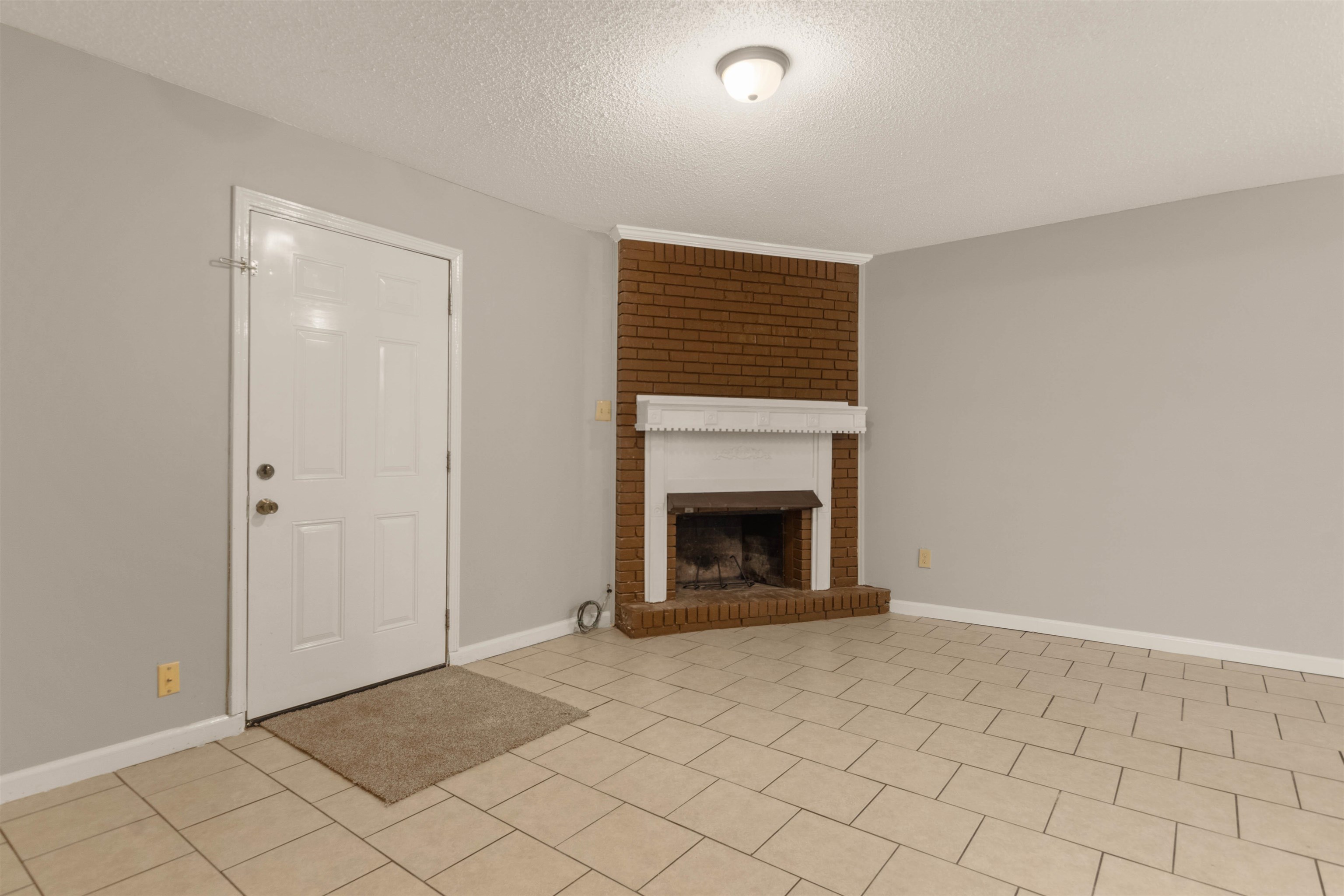 5573 Pleasant View Road, Unit 35 Memphis, TN 38134 - Photo 2 of 25 a view of an empty room with a fireplace