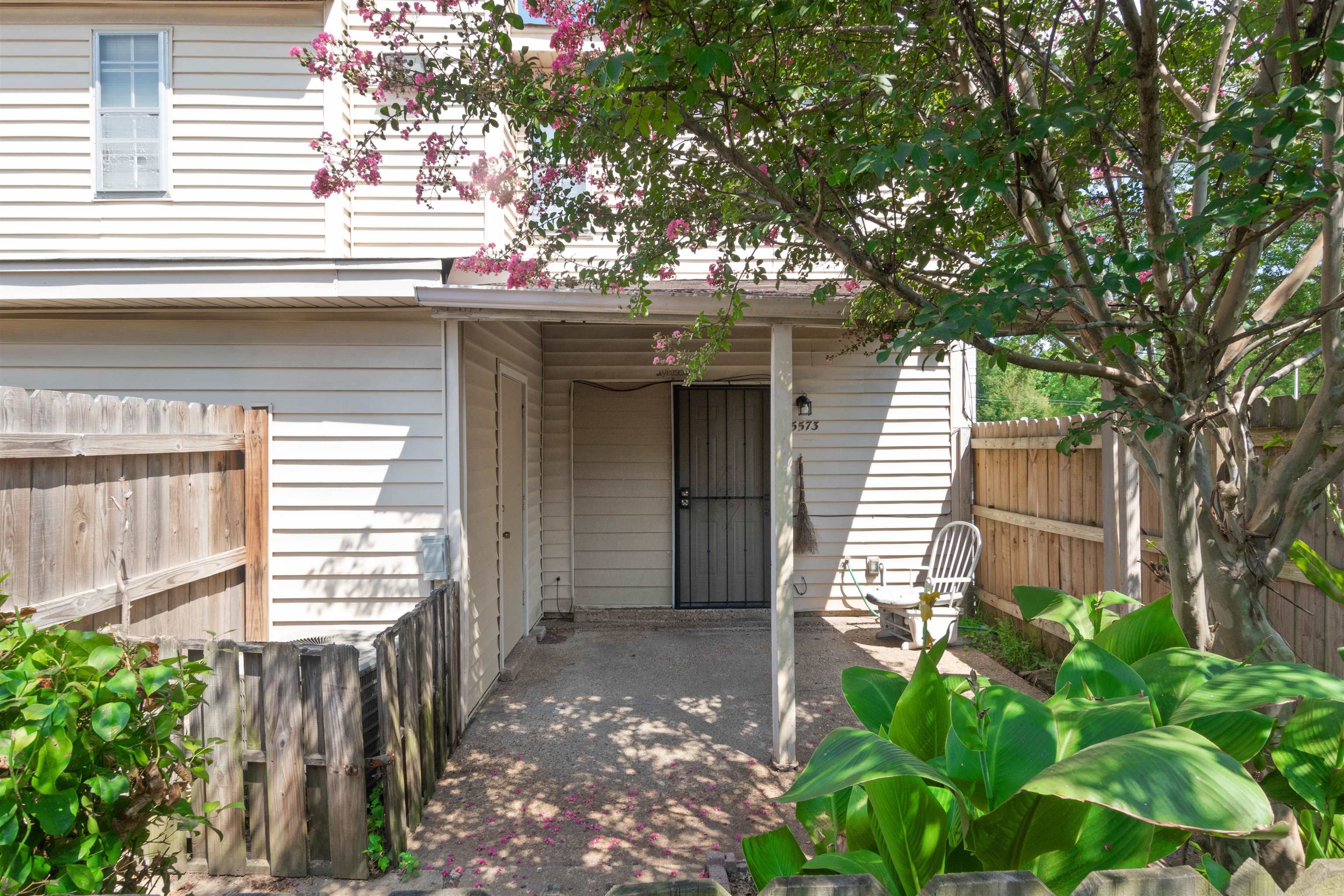 5573 Pleasant View Road, Unit 35 Memphis, TN 38134 - Photo 22 of 25 a view of a house with a tree and wooden fence