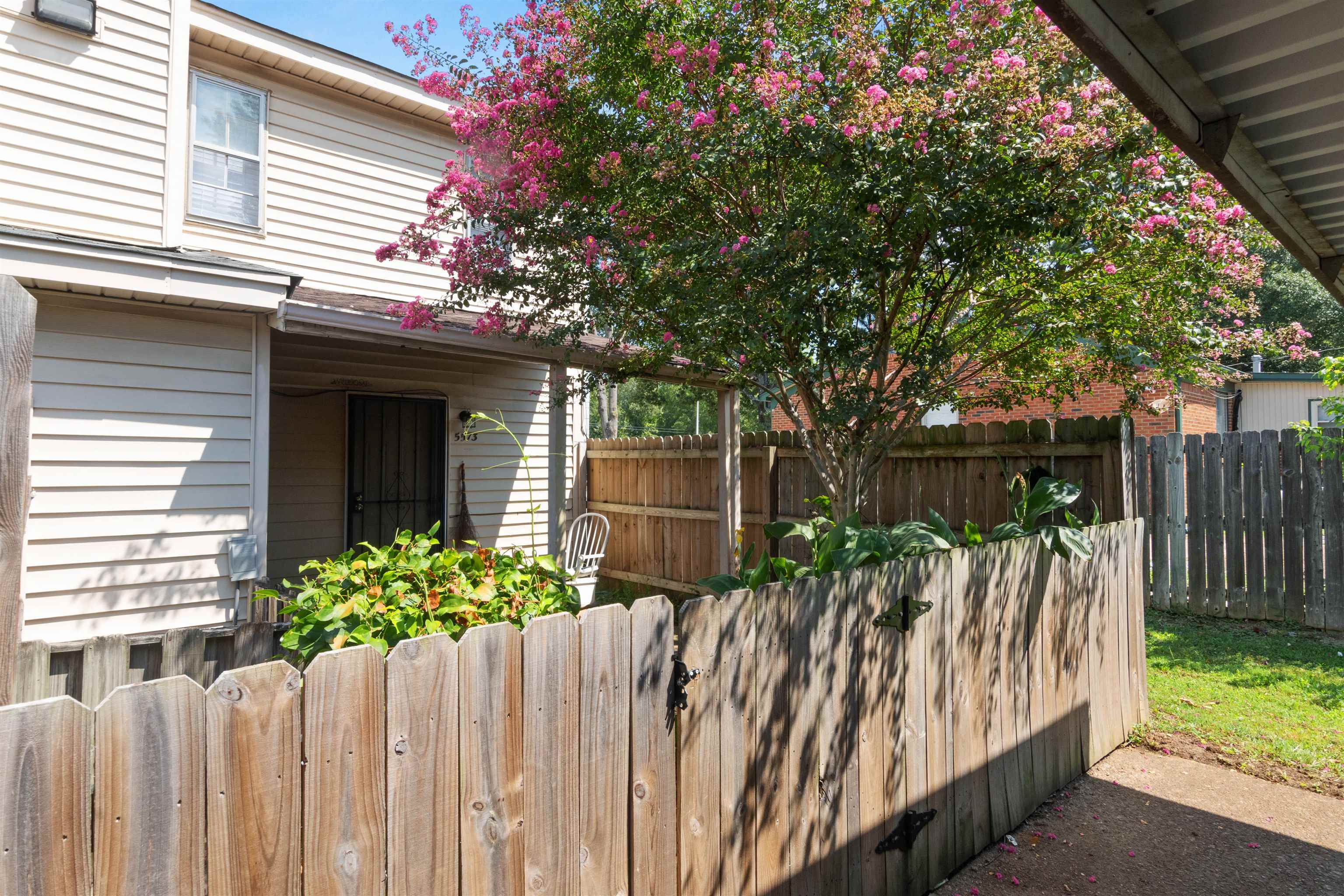 5573 Pleasant View Road, Unit 35 Memphis, TN 38134 - Photo 23 of 25 a view of a house with wooden fence